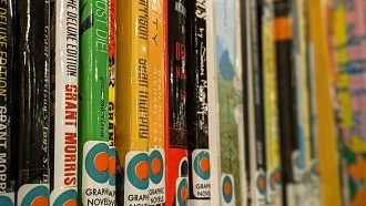 a shelf of graphic novels